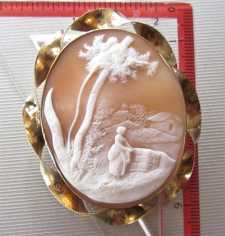 Superiorly carved landscape with woman at the wall & trees. Huge Gold or GF “twisted rope” etched Brooch. Circa 1880.