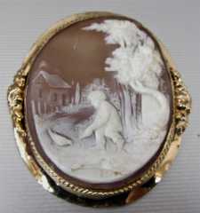 Museum Quality scene of boy feeding chicken Light shell in Gold Plated Brooch Circa 1885