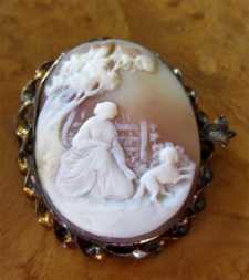 Antique Museum Quality scene of Young Woman playing with dog Gold/Gold Plated Brooch/Pendant. Circa 1870.