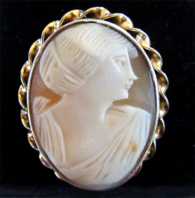 Edwardian, circa 1915 stylishly carved Art Deco portrait. Unmarked Gold or Gold filled twisted rope brooch