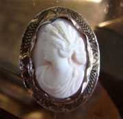Petite high relief carved Coral stone circa 1915 Unmarked Gold or GF etched & filigree brooch