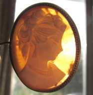 Girl’s profile - hand carved Sardonyx shell from 1950th . Gold washed silver brooch/pendant.