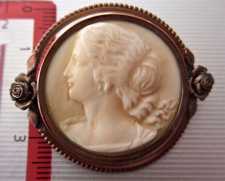 Masterly hand carved ivory or faux ivory portrait in Gold gilded or gold color metal Brooch circa 1915