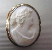 Classic hand carved Coral stone circa 1915 Unmarked Gold or GF etched brooch