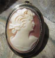 Girl’s profile - hand carved carnelian shell from 1930th . Marked Gold filled brooch/pendant.