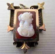 Biedermeier style circa 1850 carved hard white on red stone (agate?) Unmarked Rose Gold or Rose Gold plated pendant