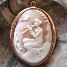 Early Art Deco cameo woman (Psyche?) playing double flute Big Gold or Gold plated Pendant/Brooch. Circa 1900-1910.