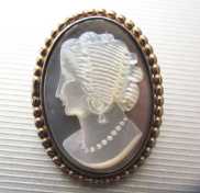 Young woman profile - hand carved Mother Pearl from 1940th . Marked 12K Gold filled brooch