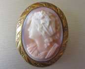 Young woman profile - carved Coral circa 1915 . Unmarked Gold washed brooch