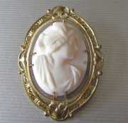 Classic hand carved Psyche’s head - coral stone circa 1910 Unmarked Gold or GF filigree brooch