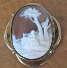 Woman at the wall & trees. Dark Carnelian shell Circa 1890. Pinchbeck Brooch. From UK Antique Action