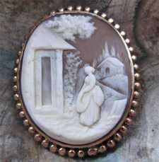 Antique Museum Quality scene of Woman at the house Gold/Gold Filled Brooch. Circa 1890.