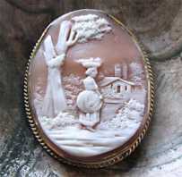 Cameo depict of landscape - woman with the basket on her head Victorian Gold Filled/Gold Plated brooch. Circa 1885.