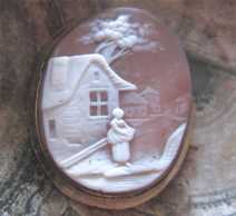 Victorian, circa 1880 well carved, shell scene with women at the house Gold gilded bezel brooch.