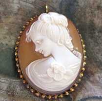 Hand carved shell - young girl profile. Signed by the Artist Marked 12K Gold filled “twisted rope” Brooch/Pendant.