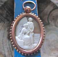 Cameo depict of detailed carving of man & woman at the rock and plant Antique Gold Plated Cooper brooch. Circa 1885. Signed
