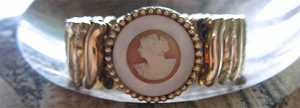 Well hand carved shell embedded in mother pearl Gold washed marked Bracelet