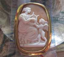 Museum Quality carving Venus with Cupped & harp. Signed by the Artist Georgian/Victorian shell in the Gold/Gold filled Brooch