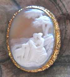 Deep relief carved shell - landscape with romantic couple & dog Victorian/Edwardian Gold plated Brooch Circa 1895-1915
