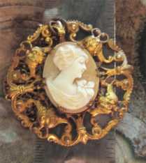 Huge from period of WWI to WWII light shell depict young girl. Unmarked Gold washed filigree pendant with the 24” chain.