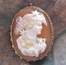 Circa 1915-1930 well carved conch shell depict Polaris -symbol of hope Unmarked Gold(?)/Gold filled custom pendant/brooch. Signed
