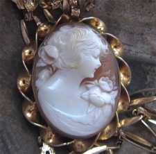 Circa 1930 Great detailed hand carved shell depict young girl. Unmarked Gold/Gold filled pendant with the 21” chain.