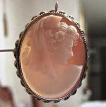 Circa 1935 high relief carved shell- girl in Scandinavian headwear. Unmarked Gold(?)/Gold plated twisted rope brooch/pendant.