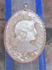 Edwardian girl’s profile - hand carved mother pearl from 1910th . Art Nouveau Gold plated(?) rope twisted style pendant.