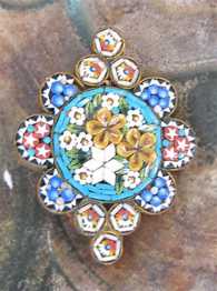 Beginning of XX century well designed floral mosaic Edwardian Gold washed cross shaped bezel brooch.
