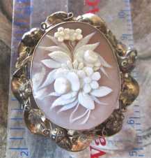 Museum quality Carnelian Shell image of bouquet embedded in Gold/Gold filled decorated brooch. Signed by the Artist