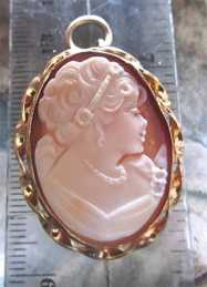 Stylishly well hand carved girlish profile Carnelian shell Vintage Marked 14K Gold Filled brooch/pendant circa 1960th. Signed