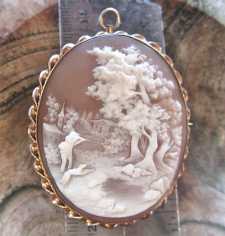 Superior detailing intricate carving shell Hunting scene Huge Gold Plated Brooch/Pendant Circa 1885.