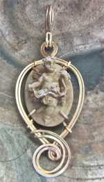 XVIII century carved lava image of cupped, signed by Author Embedded in the modern 14K Gold rolled pendant