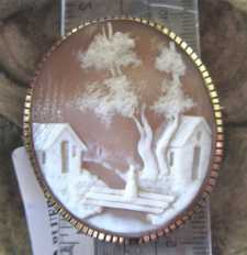 Antique quality carving village scene - woman on country bridge Huge Gold/Gold Plated Brooch. Circa 1885.