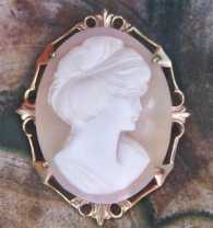 1955-1965 Greatly carved France Actress Brigitte Bardot sardonyx shell. Gold plated(?) filigree pendant/brooch, signed by the Artist.