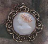 Hand carved & signed shell, profile of red head from 1920th - 1930th Unmarked Silver/Gold metal filigree rope pendant with GF chain.