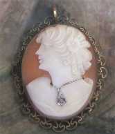 Well carved & signed shell profile with Diamond pendant. Marked 12K Gold Filled pendant/brooch from 1930th