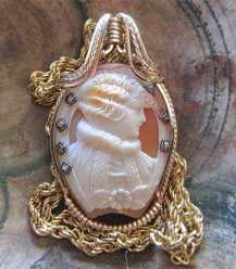 Museum Quality Edwardian Art Deco shell carving from 1910-1920. 7 European Diamonds & newer 14K Gold Rolled pendant with the chain.