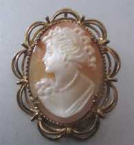 Greatly carved and signed by the Artist sardonyx shell. Gold plated(?) filigree pendant/brooch. 1935-1955