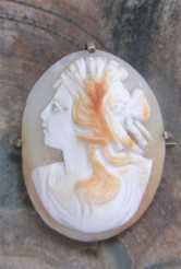 Multicolors hand carved and signed shell (Goddess Ceres?). Unmarked Gold Plated(?) Brooch circa 1920-1935.