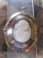 The Big hand carved Light Sardonyx shell profile. Goldish metal Pendant circa 1910-1925.