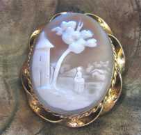 Hand carved/signed Antique shell Woman in the country landscape Gold (?)/Gold Filled etched twisted rope Brooch. Circa 1870-1880.