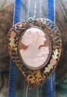Multicolored hand carved shell - profile circa 1930h. Unmarked Gold washed filigree pendant/locker.