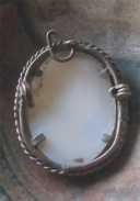 Hand carved light shell from 1930th-1940th. Unmarked Gold washed(?) copper pendant.