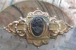 Rear carving Bakelite(?) embedded in big Edwardian Gold(?)/Gold plated with a tiny pearls brooch.