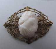 Hand carved Light Coral stone circa 1910-1925. Superior filigree decorative Gold Filled(?) Brooch.