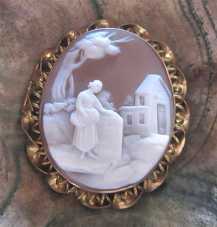 Museum hand carved shell Woman in the country landscape Gold (?)/Gold Filled filigree Brooch. Circa 1890-1910.