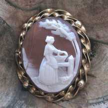 Quality hand carved Brown shell woman in the country landscape Huge Gold (?)/Gold Filled filigree Brooch. Circa 1870-1890.