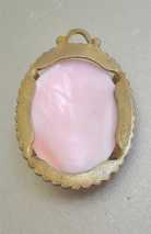 Hand carved/signed Ceres Goddess Coral 1890-1910. (L) Unmarked Gold Plated(?) decorated pendant.