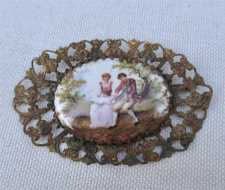 Hand painted & signed watercolor pastoral scene Fiddler & Girl. Circa 1890-1910 in Gold washed Huge Filigree Brooch